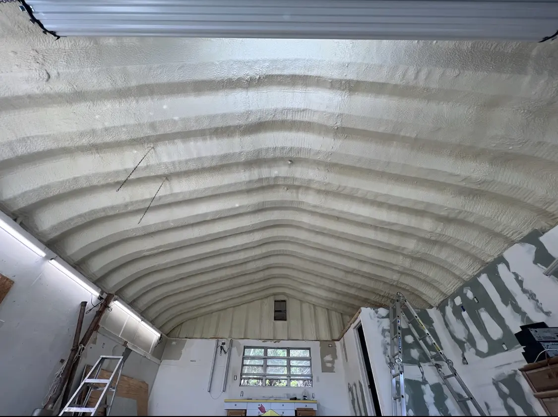 Spray polyurethane foam applied to the underside of a metal roof deck in Carson City